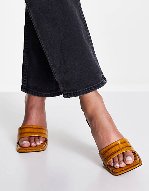 ASOS DESIGN heeled mules in mustard yellow